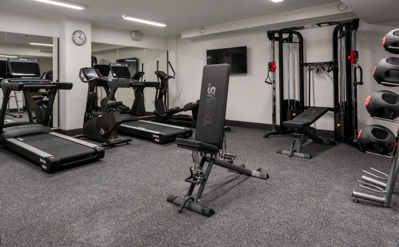 Gym with treadmills and equipment at voco Edinburgh - Haymarket by IHG