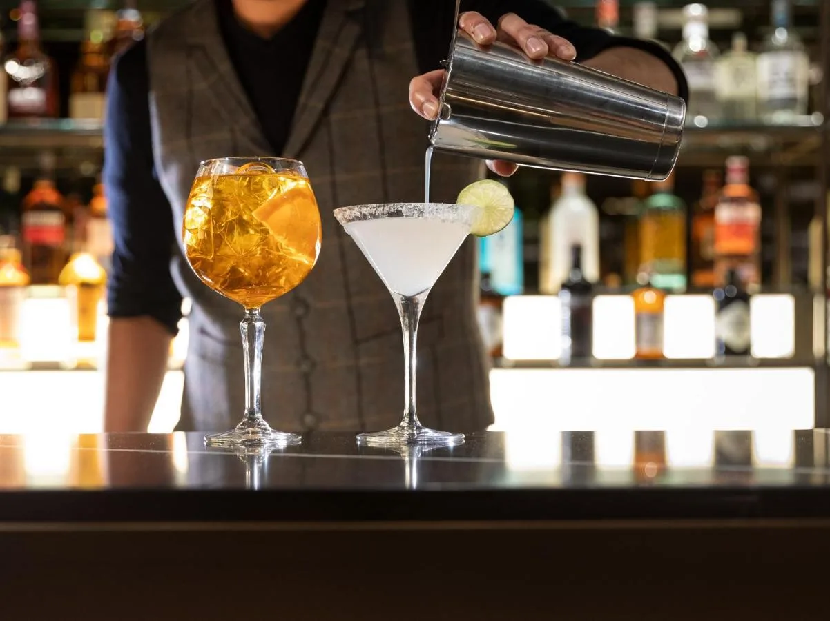 Bartender preparing a drink at the bar at voco Edinburgh - Haymarket by IHG