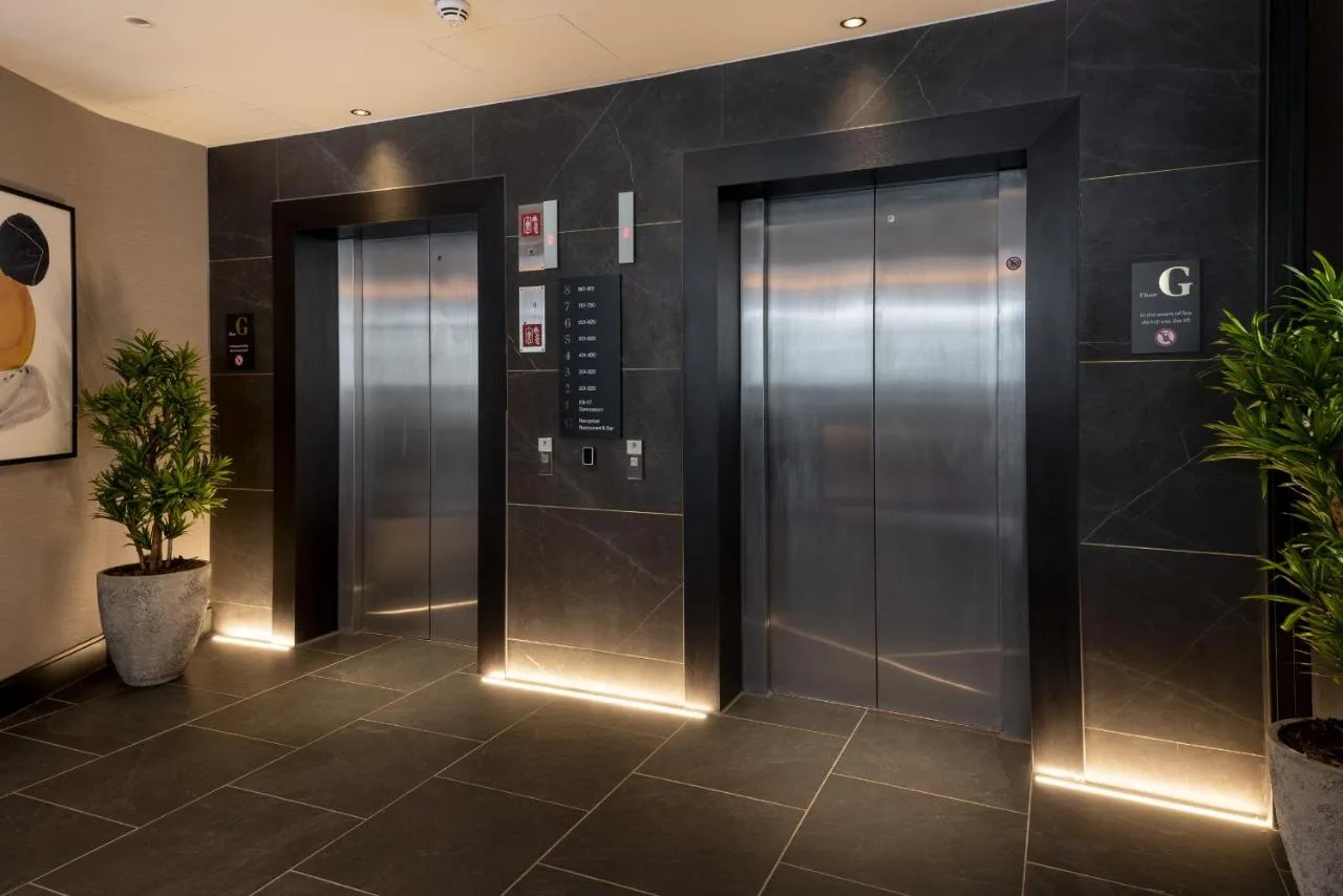 Lift lobby with two elevators at voco Edinburgh - Haymarket by IHG